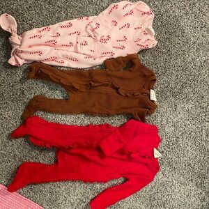 Newborn girls onesies Spearmint Love Brand.